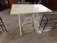 WHITE MARBLE ON VINTAGE TREADLE BASE.  
$75.00