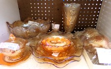 Marigold carnival glass - mostly Iris design/large footed bowl is Oak leaf design - beautiful collection *Sold separately
Featured item is the candy dish on left side of photo
$18.00