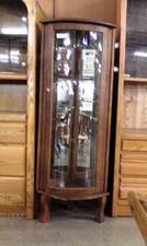 Corner Curio cabinet.  Small with mirrored backs.  Nice oak frame has no shelves with it.  Has a light socket to lighten your treasure
$47.50