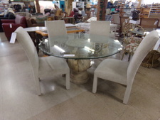 Dining table with pillar base and round glass top
Comes with 4 upholstered chairs
$278.50