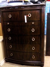 Dark tiger wood dresser.  has 6 drawers - one is a jewelry tray.  Handles are a soft copper
$895.00